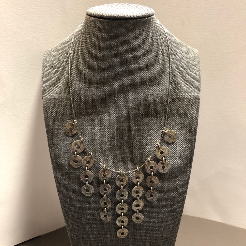 Silver tone necklace.